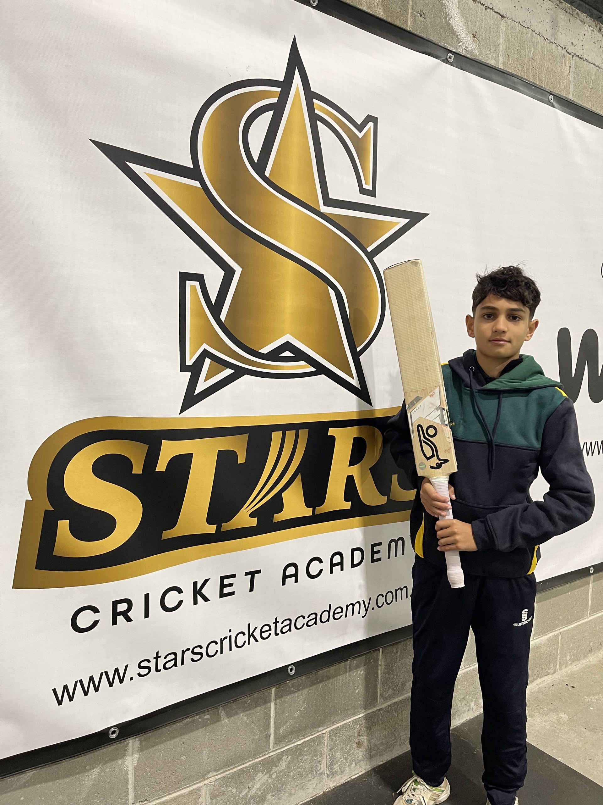 Young player with bat at Stars Cricket Academy